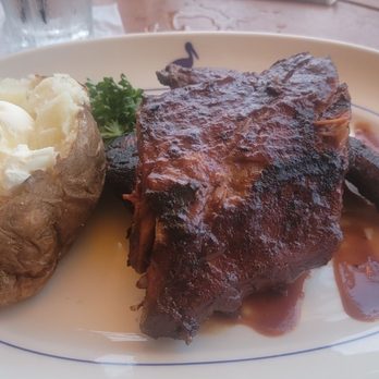 Houston's Restaurant - Ribs with baked potato - American Near Me - Pompano Beach, Florida Houston's Restaurant - Ribs with baked potato - American Near Me - Pompano Beach, Florida