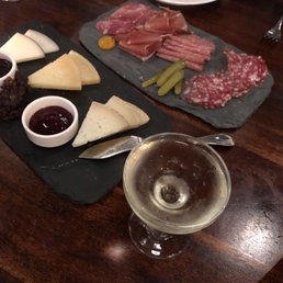 Cheese and charcuterie plates- first course of the tasting menu Cheese and charcuterie plates- first course of the tasting menu