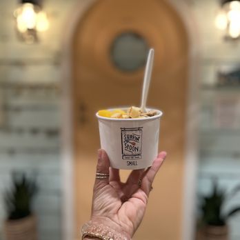 Surfin' Spoon -  hand holding a cup of ice cream - Ice Cream & Frozen Yogurt Near Me - Nags Head, North Carolina