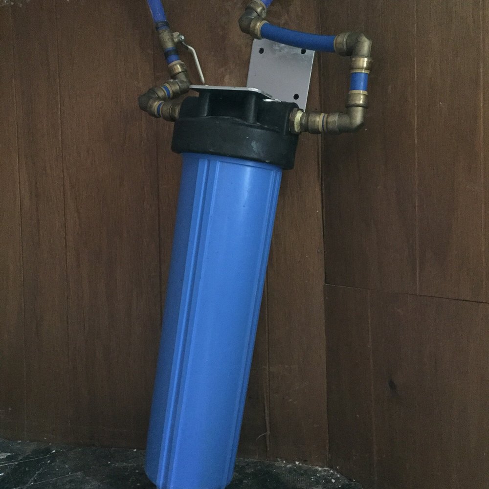 Wehby Plumbing - This is the water filter that Wehby installed. They didn't mount it to anything so now it just hangs by the pex pipes it's connected to. - Backflow Services Near Me - Nashville, Tennessee Wehby Plumbing - This is the water filter that Wehby installed. They didn't mount it to anything so now it just hangs by the pex pipes it's connected to. - Backflow Services Near Me - Nashville, Tennessee