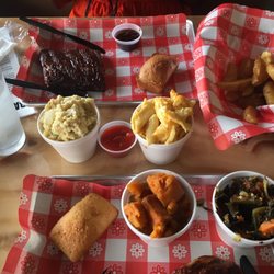 Backyard Barbeque - 1/4 BBQ chicken 1/2 slab ribs  Yams, Mac- N - Cheese, potato salad, collard greens, corn bread, potato wedges
