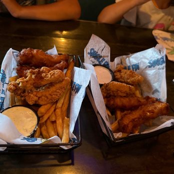 Single Fin Surf Grill - Kids are splitting the chicken tenders and the fish and chips!! - Bars Near Me - San Diego, California Single Fin Surf Grill - Kids are splitting the chicken tenders and the fish and chips!! - Bars Near Me - San Diego, California