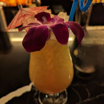 The Upright - a cocktail with a purple flower in it - Cocktail Bars Near Me - Detroit, Michigan