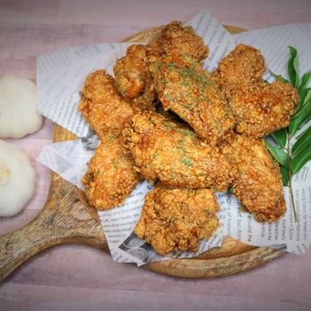 Koko Chicken 92 - fried chicken on a cutting board - Korean Near Me - Sunrise, Florida Koko Chicken 92 - fried chicken on a cutting board - Korean Near Me - Sunrise, Florida