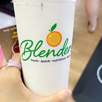 Blenders in the Grass - a person holding a drink - Juice Bars & Smoothies Near Me - Goleta, California Blenders in the Grass - a person holding a drink - Juice Bars & Smoothies Near Me - Goleta, California