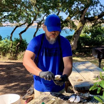 Tomales Bay Oyster Company - Some dude shucking the oysters at Tomales Bay State Park - Seafood Markets Near Me - Marshall, California Tomales Bay Oyster Company - Some dude shucking the oysters at Tomales Bay State Park - Seafood Markets Near Me - Marshall, California
