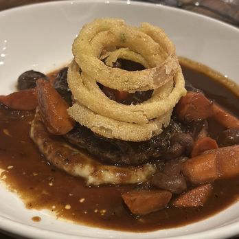 Raven and Lily restaurant - Hamburger Steak over Mashed Potatoes with mushrooms and carrots topped with onion rings - Southern Near Me - Collierville, Tennessee
