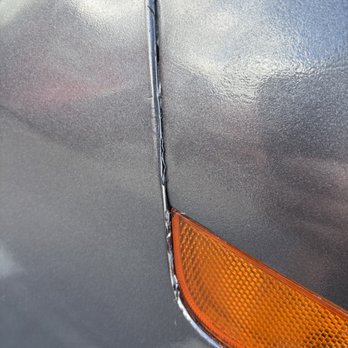 Fender Menders - After the fix (note left-over tape) - Mobile Dent Repair Near Me - Kissimmee, Florida