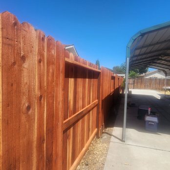 Delgado Fence - Closeup of stained fence. - Fences & Gates Near Me