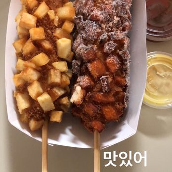 Seoul Hotdog - Corn dog topped with French fries and mozzarella stick topped with sweet potato and sugar... Yummy - Hot Dogs Near Me - Berkeley, California