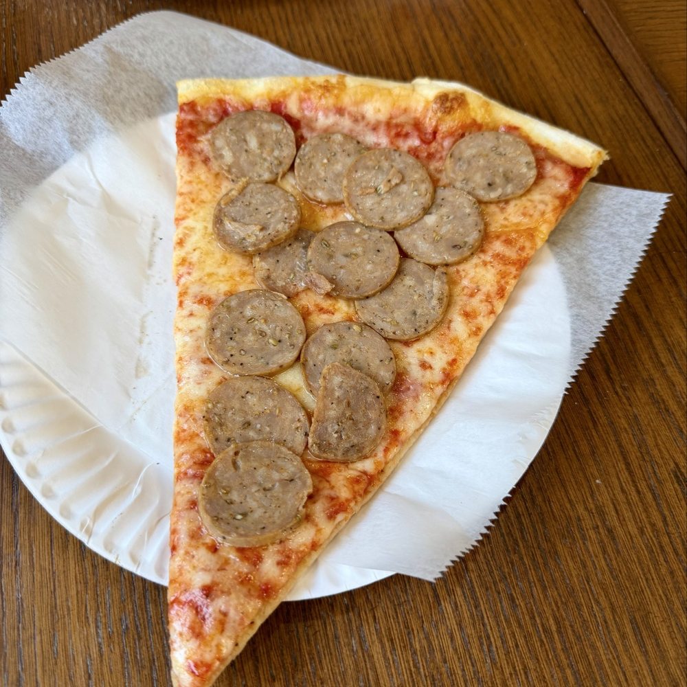 Zio's Pizzeria - Sausage slice - Pizza Near Me - New City, New York Zio's Pizzeria - Sausage slice - Pizza Near Me - New City, New York