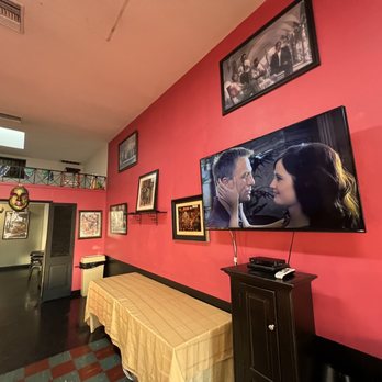 Bayou Grille - a dining room with a flat screen tv - Cajun/Creole Near Me - Inglewood, California
