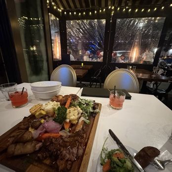 RoVino Restaurant + Bar - Carni Miste: half rotisserie chicken, premium cut steak, spicy sausages, veggies and potatoes - Italian Near Me - San Diego, California RoVino Restaurant + Bar - Carni Miste: half rotisserie chicken, premium cut steak, spicy sausages, veggies and potatoes - Italian Near Me - San Diego, California