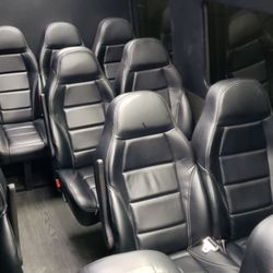 Charter Transportation Services - Leather interior fold down tables allow you to work in comfort