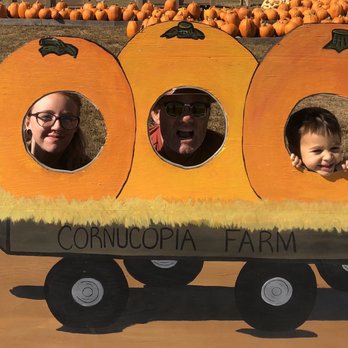 Cornucopia Farm - two people and a tractor - Farmers Market Near Me - Scottsburg, Indiana