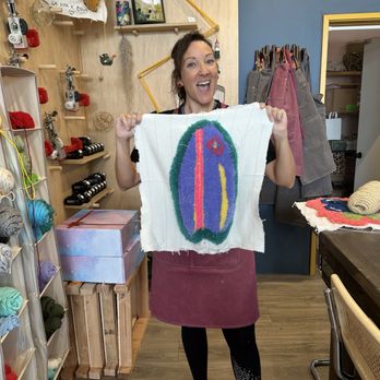 Kraft Stories - Chiara holding up Rug Tufting creation. - Art Classes Near Me - Honolulu, Hawaii Kraft Stories - Chiara holding up Rug Tufting creation. - Art Classes Near Me - Honolulu, Hawaii