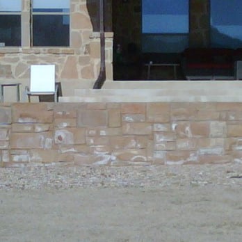 Barefoot Pools - a patio with chairs and a fire hydrant - Landscaping Near Me