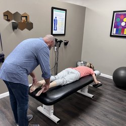 Back to Health - Ramona Chiropractor - Dr O'Dell adjusting a patient before her laser treatment