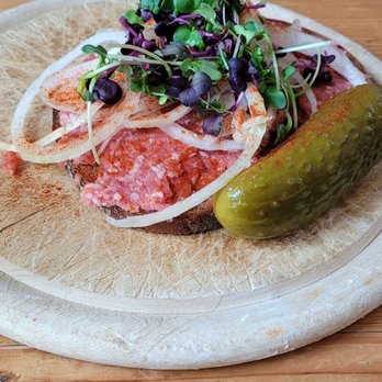 Sternbäck - Sternis Metthappen - raw pork on rye bread with onions, greens, paprika, and a pickle. - Pubs Near Me - Würzburg, BY Sternbäck - Sternis Metthappen - raw pork on rye bread with onions, greens, paprika, and a pickle. - Pubs Near Me - Würzburg, BY