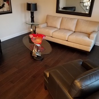 Millworks - a living room with leather furniture - Flooring Near Me - Peoria, Illinois