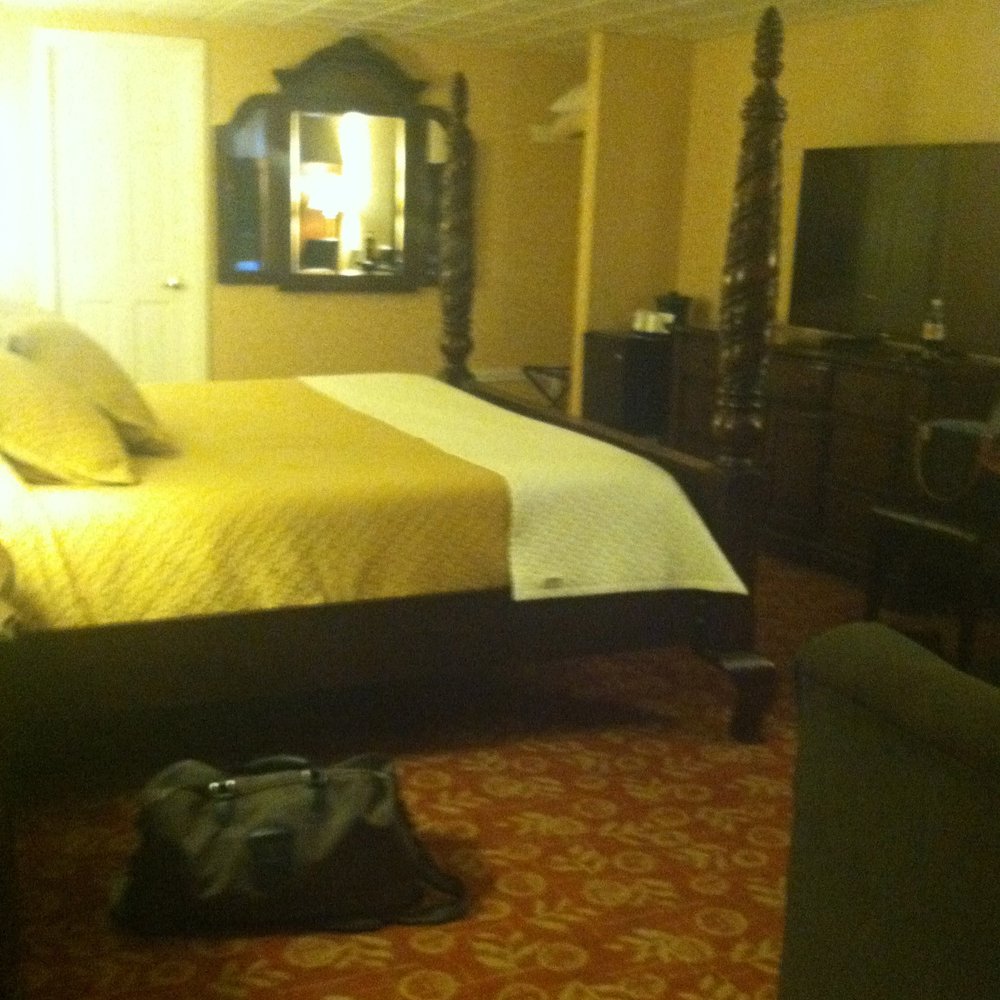 Luxury King Suite with updated tv, fireplace, and two person jacuzzi. Luxury King Suite with updated tv, fireplace, and two person jacuzzi.