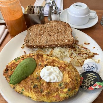 Meli Cafe - Spicy Flamenco Omelet - New American Near Me - Chicago, Illinois Meli Cafe - Spicy Flamenco Omelet - New American Near Me - Chicago, Illinois