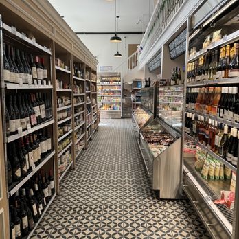 Le Marche Cezanne - a grocery store aisle with wine on the shelves - Grocery Near Me - San Francisco, California Le Marche Cezanne - a grocery store aisle with wine on the shelves - Grocery Near Me - San Francisco, California