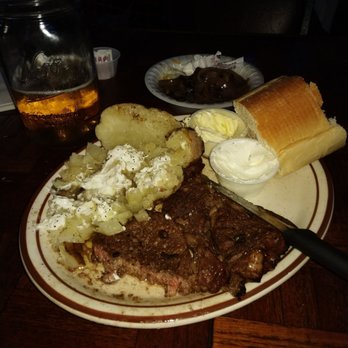 Rainbow Saloon - a plate of steak, potatoes, and bread - Sports Bars Near Me - Roy, Utah