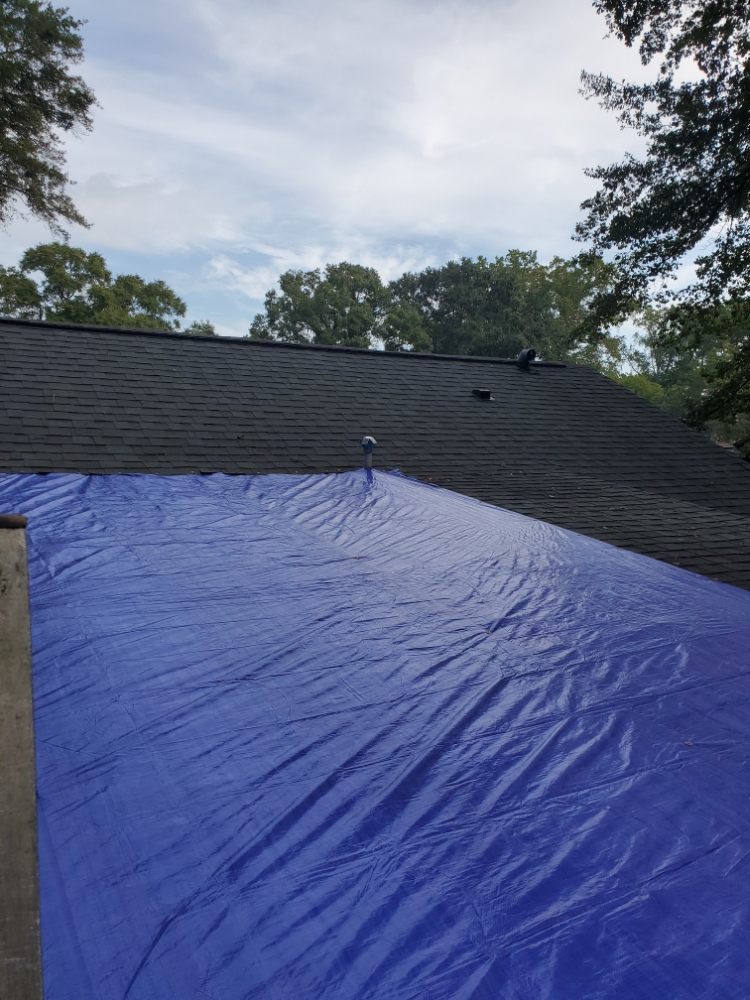 Slide of Tom and Jerry's Roofing