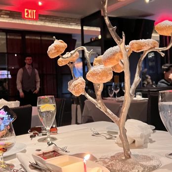 Steak 44 - Beignet tree for my birthday complimentary with warm vanilla and chocolate dipping sauces - Steakhouses Near Me - Phoenix, Arizona