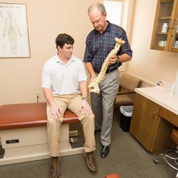 Herring Spine & Rehab - Dr. Ron with a patient