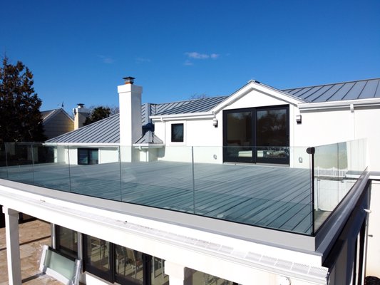 2 Level Terrace in Glass - White Azek trim, Trex decking, and crystal-clear, tempered glass for terrace and pool railings. We completed this project in the summer of 2019 in Atlantic Beach, NY. 2 Level Terrace in Glass - White Azek trim, Trex decking, and crystal-clear, tempered glass for terrace and pool railings. We completed this project in the summer of 2019 in Atlantic Beach, NY.