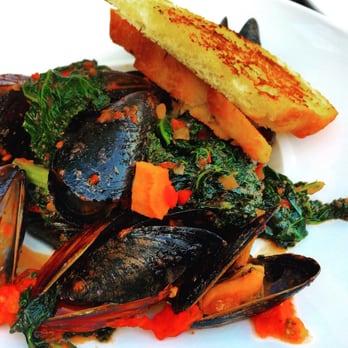 Hunters Landing - Mussels in a tomato chorizo sauce with lots and lots of kale. - Comfort Food Near Me - Toronto, Ontario Hunters Landing - Mussels in a tomato chorizo sauce with lots and lots of kale. - Comfort Food Near Me - Toronto, Ontario