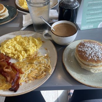 The Jagged Fork - classic breakfast--eggs, bacon, hash browns, mini pancake stack, and bottomless coffee are all on point. - Waffles Near Me - Lathrup Village, Michigan The Jagged Fork - classic breakfast--eggs, bacon, hash browns, mini pancake stack, and bottomless coffee are all on point. - Waffles Near Me - Lathrup Village, Michigan