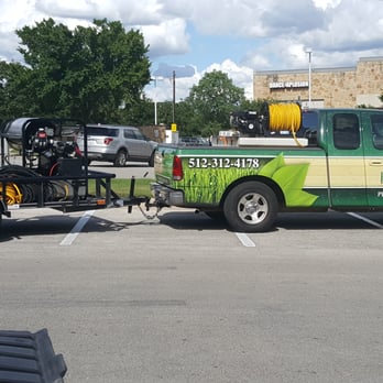 Greener Horizons Property Services - a green and yellow truck parked in a parking lot - Pressure Washers Near Me - Austin, Texas Greener Horizons Property Services - a green and yellow truck parked in a parking lot - Pressure Washers Near Me - Austin, Texas