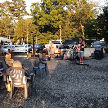 Windward Tavern - a group of people sitting at a picnic table - Bars Near Me - Brick, New Jersey