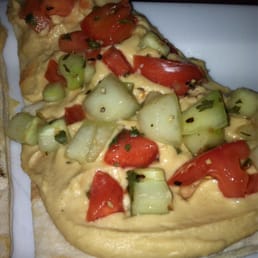 Fiesta Flatbread. Hummus, cucumber, tomato, and line juice. Fiesta Flatbread. Hummus, cucumber, tomato, and line juice.