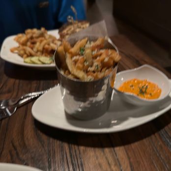 Moody's Lounge - a person sitting at a table with food - Lounges Near Me - Grand Junction, Colorado