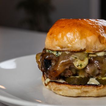 Native Fields - Grass-Fed Beef Burger, we make our buns in house, with caramelized onions, gruyere cheese, aioli and pickles.  Lunch and Dinner - New American Near Me - Walnut, California