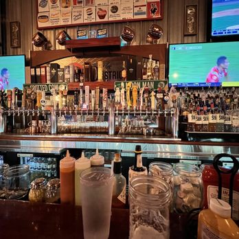 The District Pub & Grill - the bar and the televisions - New American Near Me - Eau Claire, Wisconsin The District Pub & Grill - the bar and the televisions - New American Near Me - Eau Claire, Wisconsin