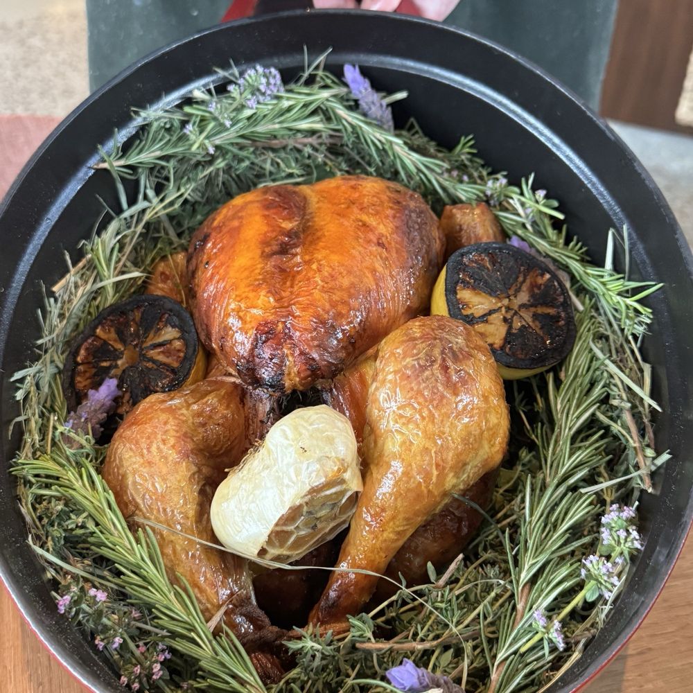 Fleurette - Herb-roasted golden chicken; moist and juicy with a lightly crispy skin. A rustic, generous portion perfect for sharing with four. - French Near Me - San Diego, California