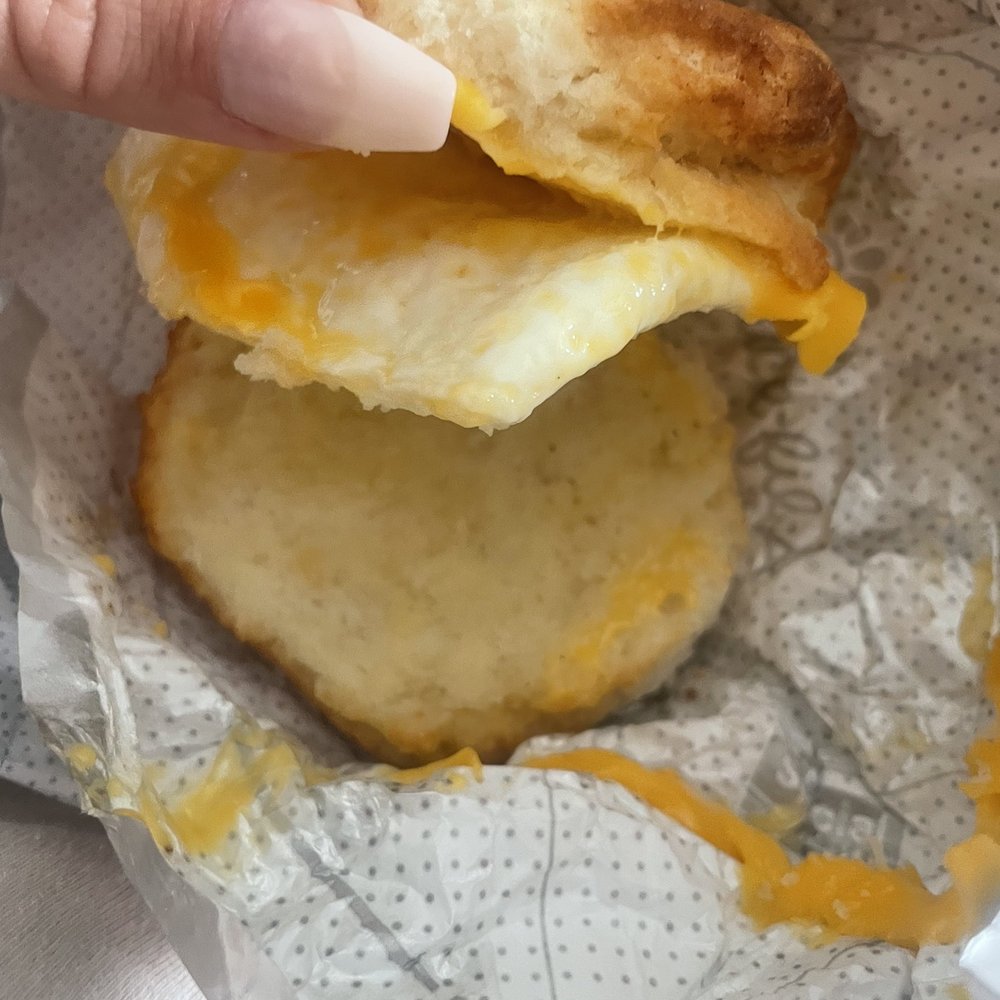Chick-fil-A - ows a hand holding a biscuit sandwich - Fast Food Near Me - San Antonio, Texas Chick-fil-A - ows a hand holding a biscuit sandwich - Fast Food Near Me - San Antonio, Texas
