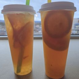Passion fruit jasmine tea with crystal boba and a mango jasmine tea with mango Passion fruit jasmine tea with crystal boba and a mango jasmine tea with mango