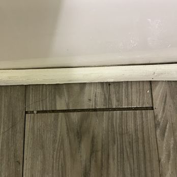 Sands Ocean Club Resort - Wooden tile next to the bathtub, water was seeping from the bathtub under the board they squished every time you walked on them and the whol - Resorts Near Me - Myrtle Beach, South Carolina