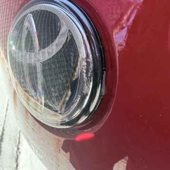 PPF Pros - Front emblem was cracked from where they tried to lift it off with a car tucking tool or something - Auto Detailing Near Me - Los Angeles, California PPF Pros - Front emblem was cracked from where they tried to lift it off with a car tucking tool or something - Auto Detailing Near Me - Los Angeles, California