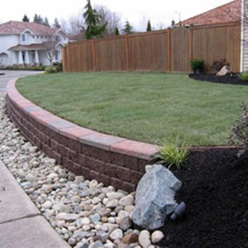 Skinner Landscape Service - Installed a beautiful block wall w/ cap that is at the perfect height to sit on. Finished the yard off with a new sod lawn and planted beds. - Landscaping Near Me - Snohomish, Washington Skinner Landscape Service - Installed a beautiful block wall w/ cap that is at the perfect height to sit on. Finished the yard off with a new sod lawn and planted beds. - Landscaping Near Me - Snohomish, Washington