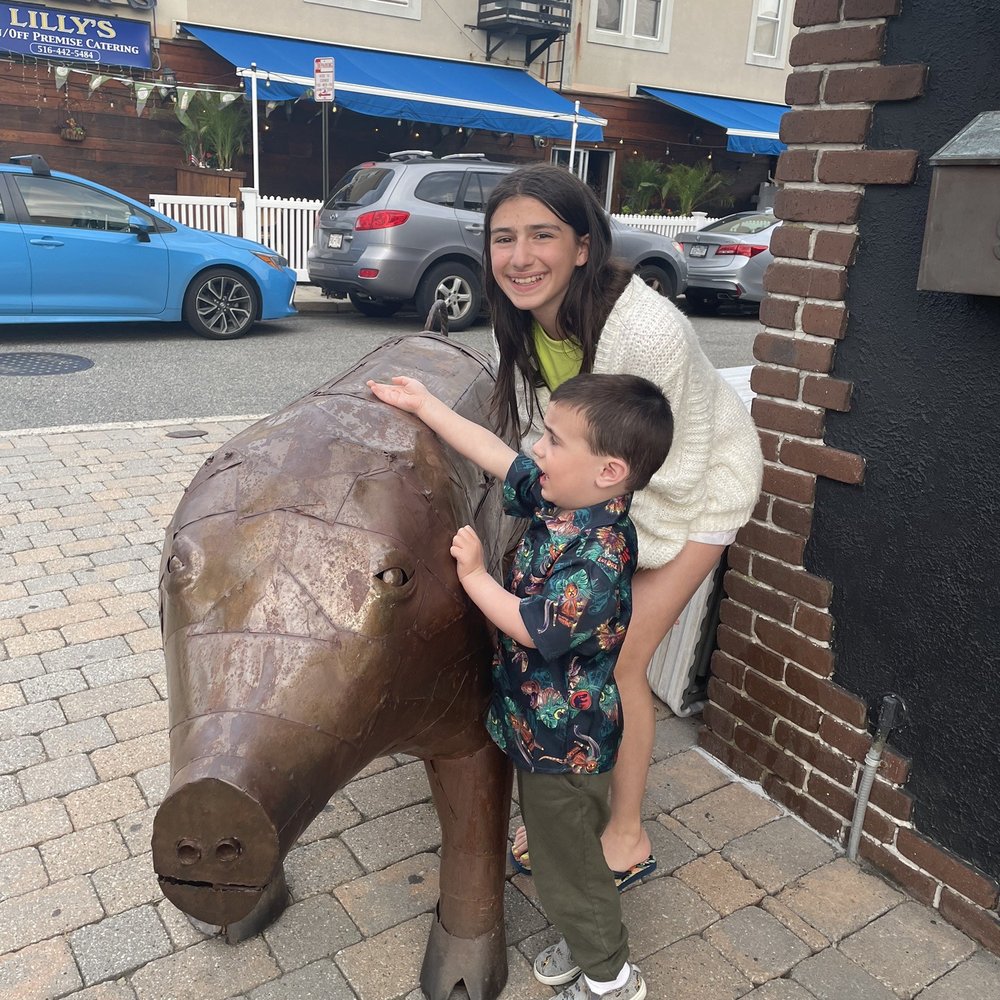 Grotta Di Fuoco - Signature pig on the corner outside - Pizza Near Me - Long Beach, New York Grotta Di Fuoco - Signature pig on the corner outside - Pizza Near Me - Long Beach, New York