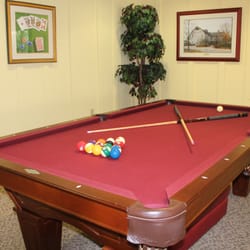 SharonBrooke - Game room with billiards, darts, large chessboard, and card table.