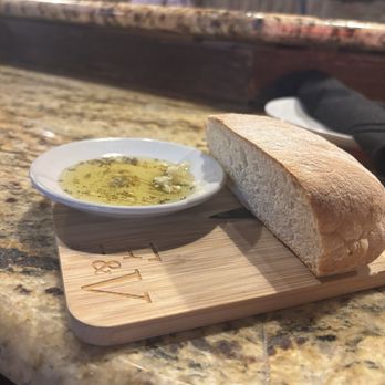 Fork And Vine - There amazing complementary baked bread with oil and herbs. - Italian Near Me - Lenoir City, Tennessee Fork And Vine - There amazing complementary baked bread with oil and herbs. - Italian Near Me - Lenoir City, Tennessee