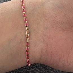Enamel/ gold fill on brass chain with a charm. Enamel/ gold fill on brass chain with a charm.